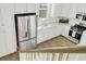 Modern kitchen featuring stainless steel appliances, granite countertops, and white cabinets, showcasing a sleek design at 2539 Blue Crane Circle # 101, Myrtle Beach, SC 29577