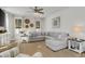 Inviting living room features a ceiling fan and neutral colors with a gray couch and wood flooring at 2539 Blue Crane Circle # 101, Myrtle Beach, SC 29577