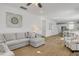 Comfortable living room in neutral colors featuring wood floor and large gray sectional sofa at 2539 Blue Crane Circle # 101, Myrtle Beach, SC 29577