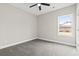 Bright bedroom with carpeted floor and large window at 270 Russ Rd., Loris, SC 29569