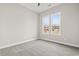 Bright bedroom with gray carpet and two windows at 270 Russ Rd., Loris, SC 29569