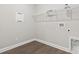 Laundry room with wire shelving and vinyl flooring at 270 Russ Rd., Loris, SC 29569