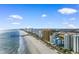 Wide aerial view of a coastal community with condos, beaches, and the ocean on a clear day at 2700 N Ocean Blvd. # 253, Myrtle Beach, SC 29577