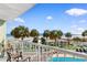 Relaxing balcony showcasing ocean views, palm trees, and the pool area at 2700 N Ocean Blvd. # 253, Myrtle Beach, SC 29577