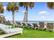 Relaxing beach view with lounge chairs, artificial turf, and clear blue skies at 2700 N Ocean Blvd. # 253, Myrtle Beach, SC 29577