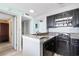 Kitchen featuring black appliances, granite countertops, and tiled backsplash at 2700 N Ocean Blvd. # 253, Myrtle Beach, SC 29577