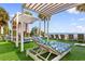 Relaxing beachside pool area featuring lounge chairs under shaded pergolas on a sunny day at 2700 N Ocean Blvd. # 253, Myrtle Beach, SC 29577