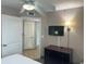 Bedroom with a TV, ceiling fan, closet, and light-colored walls at 3500 N Ocean Blvd. # 501, North Myrtle Beach, SC 29582