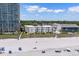 Aerial view of the beachfront condo building near the beach, showcasing its proximity to the ocean and surrounding buildings at 3701 S Ocean Blvd. S # 206, North Myrtle Beach, SC 29582