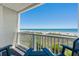 Beautiful balcony with cozy chairs offering amazing ocean views, perfect for enjoying morning coffee or evening sunsets at 3701 S Ocean Blvd. S # 206, North Myrtle Beach, SC 29582