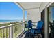 Charming balcony with comfortable seating and stunning ocean views, ideal for relaxing and enjoying coastal breezes at 3701 S Ocean Blvd. S # 206, North Myrtle Beach, SC 29582