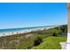 Scenic beach view overlooking the sandy shore and clear ocean waters, perfect for relaxation and recreation at 3701 S Ocean Blvd. S # 206, North Myrtle Beach, SC 29582