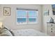 Cozy bedroom featuring light decor, window with view, and charming accents for a relaxing atmosphere at 3701 S Ocean Blvd. S # 206, North Myrtle Beach, SC 29582