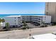 Exterior view of the condo complex with beachfront access, private parking, and a swimming pool for residents at 3701 S Ocean Blvd. S # 206, North Myrtle Beach, SC 29582