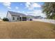 Expansive fenced backyard with a well-maintained lawn and patio at 3713 Park Pointe Ave., Little River, SC 29566