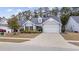 Charming single-story home with manicured lawn and attached two-car garage at 3713 Park Pointe Ave., Little River, SC 29566