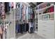 Organized walk-in closet with shelving and hanging rods for clothes and accessories at 3713 Park Pointe Ave., Little River, SC 29566