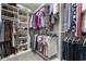 Well-organized walk-in closet with shelving for shoes and hanging rods for clothes at 3713 Park Pointe Ave., Little River, SC 29566