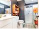 Modern bathroom with dark walls, tiled floors, glass shower and a white vanity at 3931 East Glades Dr., Myrtle Beach, SC 29588