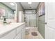 Bathroom features a shower and tub with a glass door and a white vanity at 3931 East Glades Dr., Myrtle Beach, SC 29588