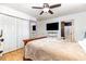 Bedroom featuring wood floors, ceiling fan, closet and a door leading to the bathroom at 3931 East Glades Dr., Myrtle Beach, SC 29588