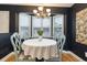 Charming dining area featuring black walls, a bay window, and a round table with seating at 3931 East Glades Dr., Myrtle Beach, SC 29588