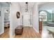 Inviting entryway with wood floors, a decorative light fixture, and views into the living spaces at 3931 East Glades Dr., Myrtle Beach, SC 29588