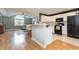 Bright kitchen featuring white cabinets, a breakfast bar, and stainless steel appliances at 3931 East Glades Dr., Myrtle Beach, SC 29588