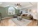 Inviting living room with a large window, a comfortable seating arrangement, and a ceiling fan at 3931 East Glades Dr., Myrtle Beach, SC 29588