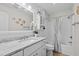 Bathroom boasts granite countertop, white cabinets, and a tub shower at 3983 Tybre Downs Circle # 3983, Little River, SC 29566