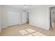 Well-lit bedroom featuring hardwood floors and double door closet at 3983 Tybre Downs Circle # 3983, Little River, SC 29566