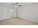 Well-lit bedroom featuring hardwood floors and two closets at 3983 Tybre Downs Circle # 3983, Little River, SC 29566