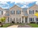 Brick townhome with gray shutters and double door entry at 3983 Tybre Downs Circle # 3983, Little River, SC 29566