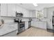 Modern kitchen with white shaker cabinets, granite countertops, and stainless steel appliances at 3983 Tybre Downs Circle # 3983, Little River, SC 29566