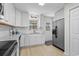 Modern kitchen with white shaker cabinets, granite countertops, and stainless steel appliances at 3983 Tybre Downs Circle # 3983, Little River, SC 29566