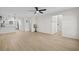 Spacious living room featuring light hardwood floors and ceiling fan at 3983 Tybre Downs Circle # 3983, Little River, SC 29566