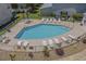 Community pool with plenty of lounge chairs at 3983 Tybre Downs Circle # 3983, Little River, SC 29566