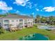 Aerial shot showcasing building's facade, landscaping, and pool at 4142 Hibiscus Dr. # 101, Little River, SC 29566