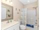 Well-lit bathroom with a shower-tub combination and a white vanity at 4142 Hibiscus Dr. # 101, Little River, SC 29566