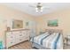 Bedroom with a beach theme decor, large dresser, and a ceiling fan at 4142 Hibiscus Dr. # 101, Little River, SC 29566