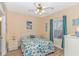 Bright bedroom with a ceiling fan, large window, and nautical decor at 4142 Hibiscus Dr. # 101, Little River, SC 29566