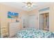 Cozy bedroom with TV, beach decor, and direct access to the bathroom at 4142 Hibiscus Dr. # 101, Little River, SC 29566