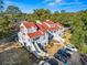 Aerial view showcasing the townhome's red roof, well-maintained landscaping, and convenient parking at 4396 Baldwin Ave. # 94, Little River, SC 29566