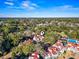 Community aerial view showcasing the property, surrounded by lush trees and a water tower in the distance at 4396 Baldwin Ave. # 94, Little River, SC 29566