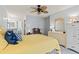 Bright bedroom with a ceiling fan and yellow quilted bedspread at 4396 Baldwin Ave. # 94, Little River, SC 29566