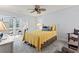 Bedroom featuring a ceiling fan and natural light from the door leading to the sunroom at 4396 Baldwin Ave. # 94, Little River, SC 29566