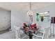 Elegant dining area featuring a chandelier and a view to the kitchen at 4396 Baldwin Ave. # 94, Little River, SC 29566