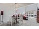 Charming dining room with a chandelier and views to the patio and living spaces at 4396 Baldwin Ave. # 94, Little River, SC 29566