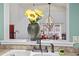 Bright kitchen sink area offering a view into the dining room with stylish decor and abundant natural light at 4396 Baldwin Ave. # 94, Little River, SC 29566