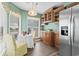 Cozy kitchen nook with a breakfast table, natural light, and classic wooden cabinets at 4396 Baldwin Ave. # 94, Little River, SC 29566